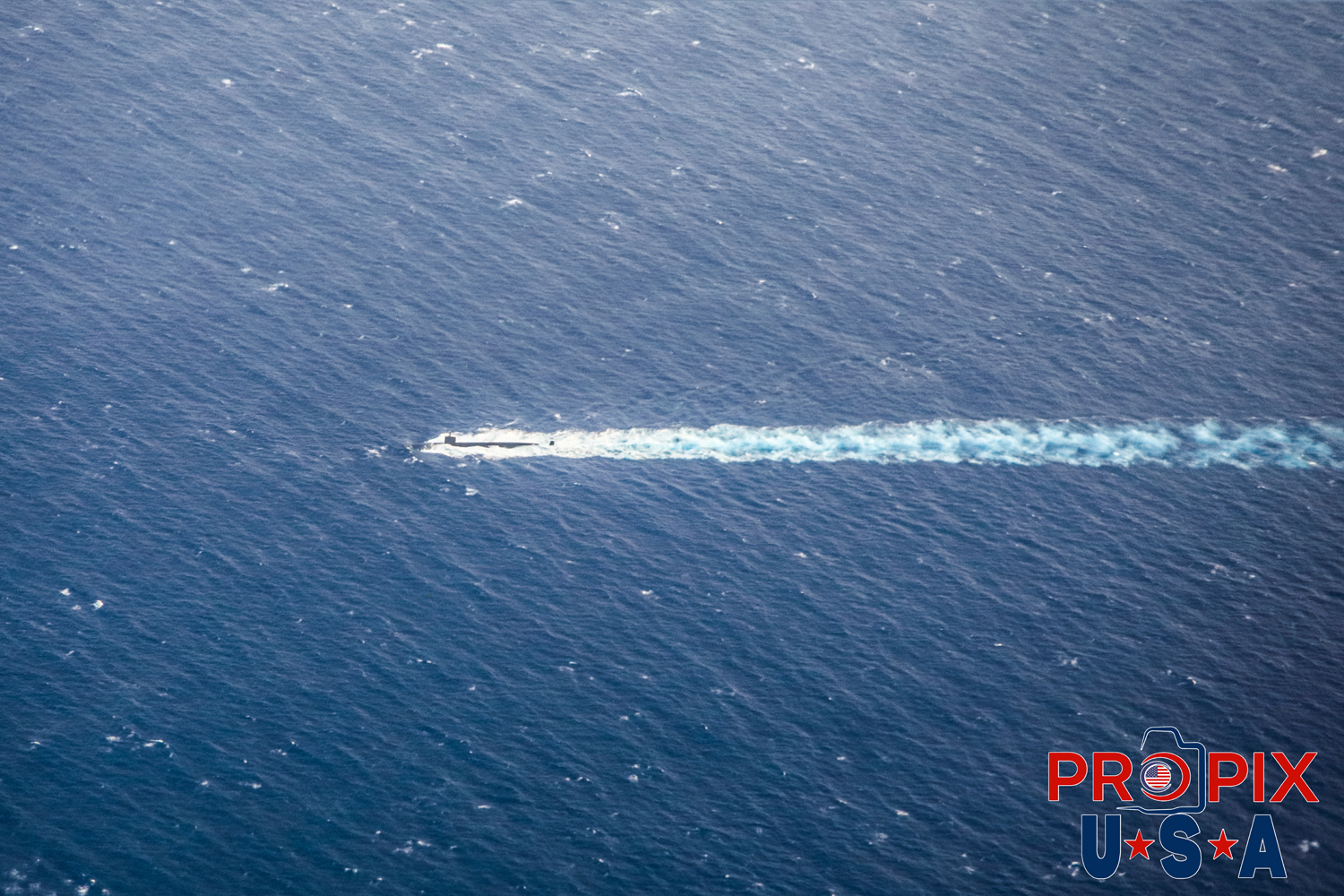 A U.S. submarine approaching Pearl Harbor as seen from a flight from HNL Honolulu to Maui Hawaii OGG Photo date: 6-28-2025